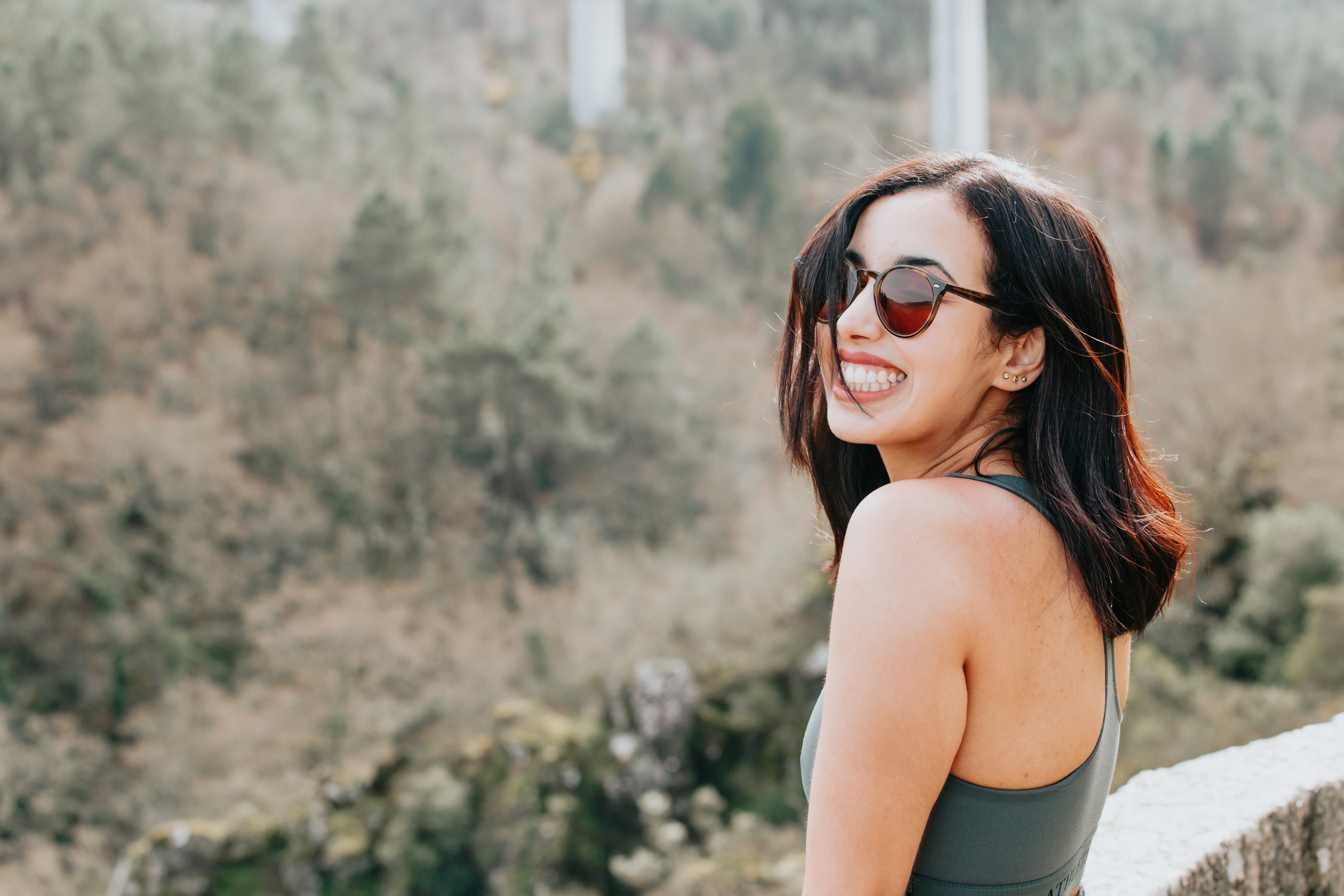 files/woman-in-round-sunglasses-smiles-wide.jpg